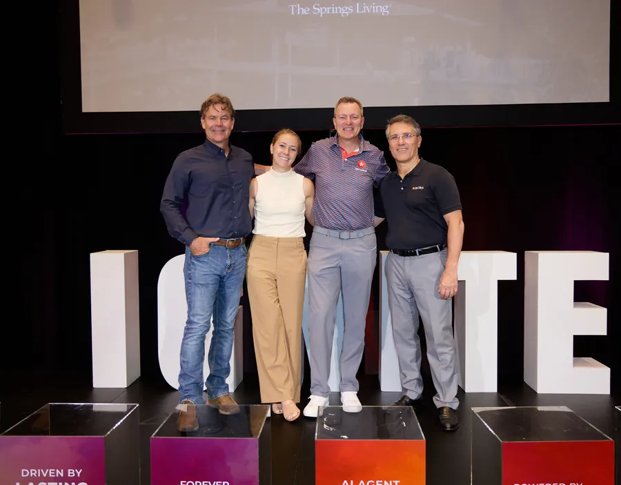 Four presenters posing on the IGNITE stage at ECRS Ignite 2026