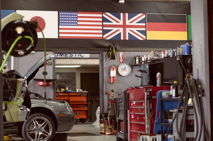 Interior of the Wursters shop with international flags and a wall of tools