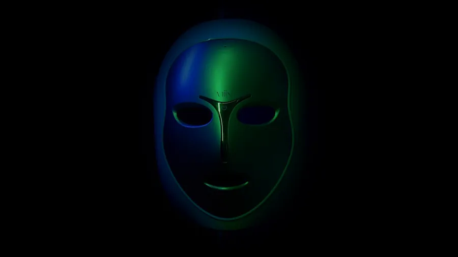 MiiN LED light therapy mask glowing green and blue in the dark, Artemis lifestyle video — click to play