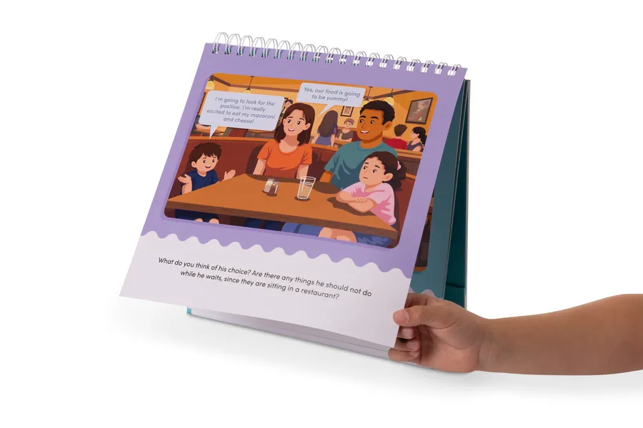 Waiting For Things We Want activity book open to an illustrated restaurant scene, product photography