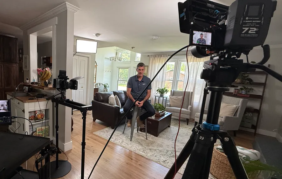 Wide view of a podcast and interview recording set styled as a living room